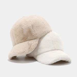 Soft faux fur winter baseball cap in beige and white with a cozy plush finish