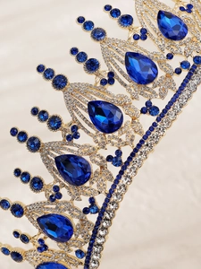 Macro detail of luxury baroque bridal crown with blue crystals and sparkling rhinestones