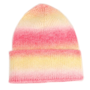 Detail of pink and yellow gradient tie-dye knit beanie with thick ribbed texture