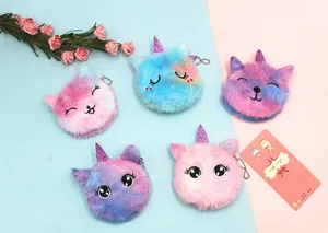 Close-up of five colorful gradient plush unicorn coin purses with metal keychains