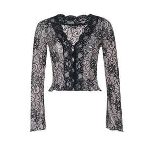 Detail of black lace slim-fit top with V-neckline and intricate floral embroidery textures