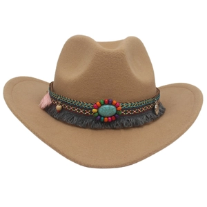 Detail of khaki cowboy hat featuring bohemian beaded band, turquoise stone, and tassels