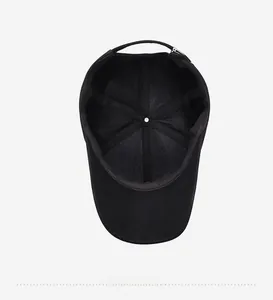 Detail view of the black baseball cap showing the breathable mesh lining and sweatband