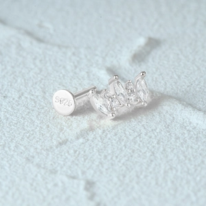 Detailed macro view of S925 sterling silver stamp and sparkling inlaid gemstones