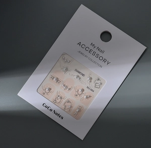 Macro shot of 5D 3D nail art charms with pearls, stars and moon patterns on packaging