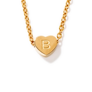 Polished gold heart pendant necklace featuring an engraved letter B on a delicate chain