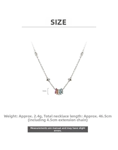 Detail of silver geometric necklace featuring five colorful stone rings and size info