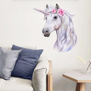 Detailed watercolor unicorn wall decal with pink roses on a neutral living room wall