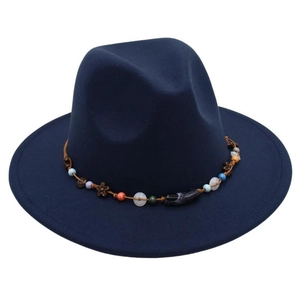 Close-up of wide-brim navy fedora featuring a colorful ethnic beaded decorative band
