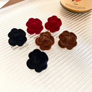 Elegant flocked camellia flower stud earrings set in black, red and mocha brown colors