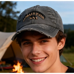 Close-up of distressed dark grey washed denim baseball cap with 3D embroidery detail