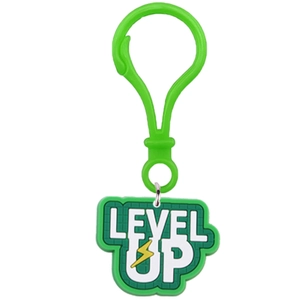 Close-up of a green silicone keychain featuring a LEVEL UP text and a lightning bolt charm