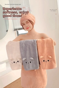 Detailed embroidery of a cute cartoon cat face on soft coral fleece microfiber towel
