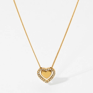 Elegant gold heart pendant necklace for women with sparkling crystal stones on white background