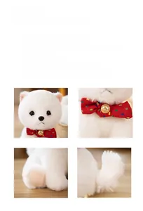 Close-up of white Pomeranian plush toy showing soft fur texture and red plaid bow tie