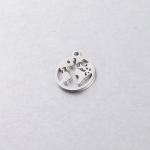 Detailed macro view of silver stainless steel world map pendant with hollowed out globe design