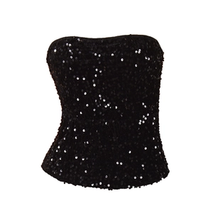 Detail of black sequins on a sexy strapless crop top with metallic reflective texture