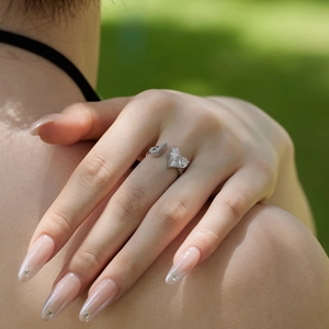 Detail view of S925 sterling silver adjustable ring with heart zircon on model hand