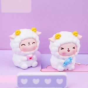 Cute resin sheep figurines with yellow horns holding pink cup and blue candy for car decor