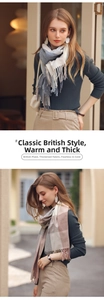Detail showing soft cashmere-like fabric texture and long fringe on plaid scarves