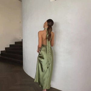 Detail of olive green satin halter maxi dress showing backless cut and neck ties