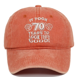 Distressed orange cotton baseball cap with 70th birthday silver embroidered text