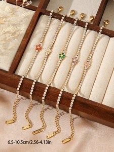 Detail of five titanium steel flower bracelets with colorful crystals and length scale
