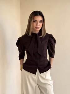 Dark brown puff sleeve blouse with a large bow tie neck and tailored waist design