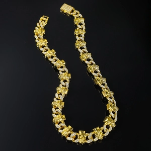Iced out gold skull necklace with pavé diamonds on Cuban link chain for men