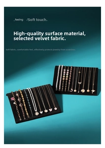 Macro shot of two premium black velvet S-shaped jewelry display boards for necklaces
