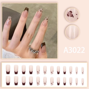 French leopard print press-on nails in long ballerina shape with nude pink base