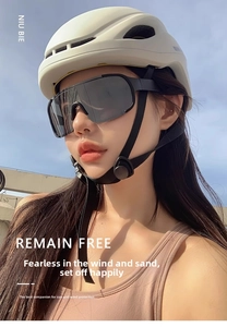 Close-up of polarized outdoor sports sunglasses with a cycling helmet on a model
