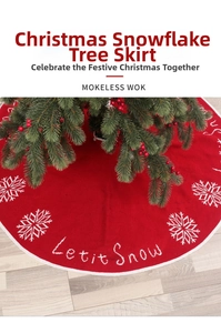 Detail of red knit Christmas tree skirt with white snowflakes and Let it Snow embroidery