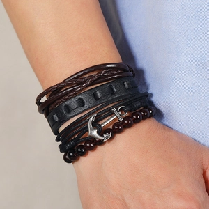 Multilayer men's leather bracelet set with anchor charm and braided cord on wrist