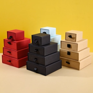 Multi-colored drawer jewelry gift boxes in red, black, blue and kraft stacked by size