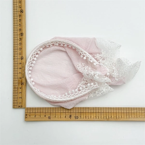 Pink seersucker lace headscarf with polka dots measuring 15cm on a white background