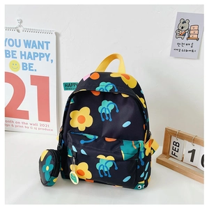 Detailed view of kids floral backpack with matching coin purse and top handle