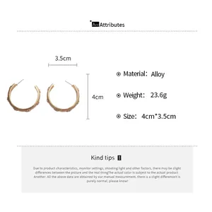 Size chart for golden C-shaped textured earrings with detailed dimensions and alloy material