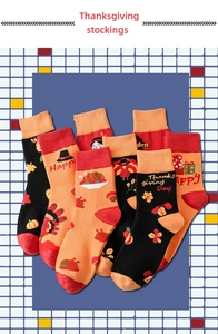 Detail of colorful Thanksgiving knitted socks with festive orange and black patterns