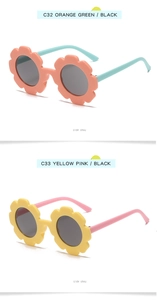 Detail view of sunflower shaped kids sunglasses in orange-green and yellow-pink colors