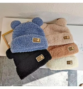 Selection of plush bear ear hats in blue black beige brown and white soft faux fur