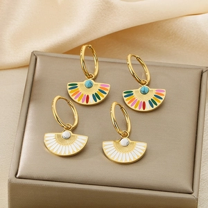 Vintage gold fan-shaped enamel earrings with marble and blue stones on satin display