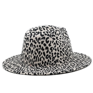 Detail of white and black leopard print fedora hat showing thick wool felt texture