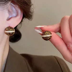 Vintage geometric leopard print stud earrings with diamond accents and gold plating