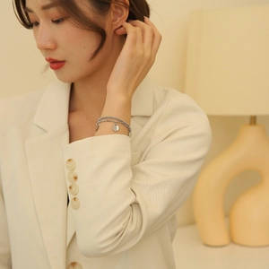 Double-layered silver titanium steel bracelet with geometric circular pendant for women