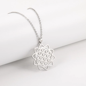 Detailed view of silver stainless steel necklace with geometric hollow flower pendant