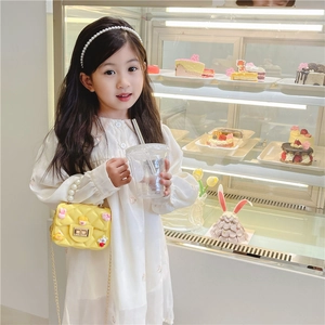 Girl's yellow quilted mini handbag with pearl handle and metal chain strap