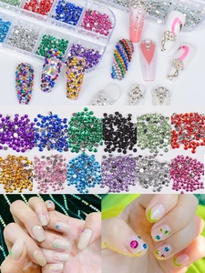 Macro detail of multi-colored acrylic nail rhinestones in a clear storage organizer box