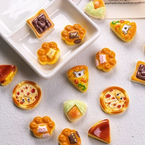 Miniature resin food models with cute animal patterns on a white ceramic plate