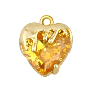 Detail of a heart-shaped yellow gemstone pendant with gold dripping design for DIY jewelry